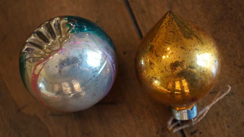 Two vintage Christmas ornaments damaged by moisture