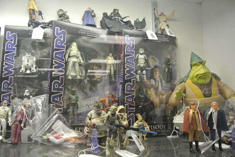 Star Wars action figures in and out of boxes