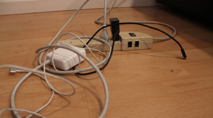 mess of chargers plugged into power strip