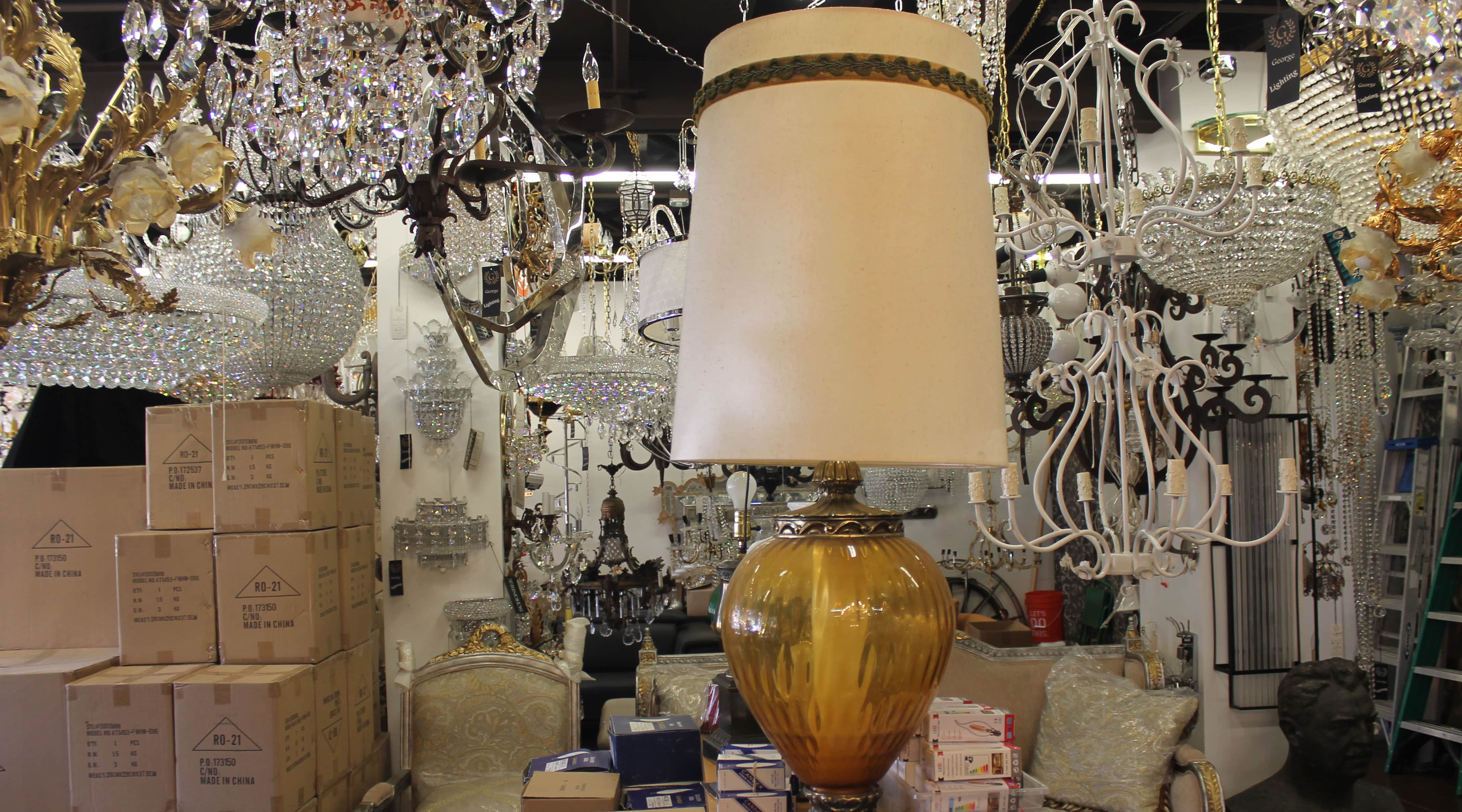 shop filled with vintage chandeliers and lamps