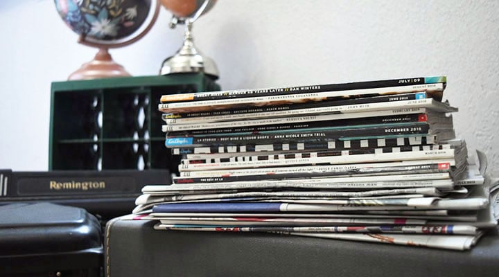 stack of old newspapers and magazines